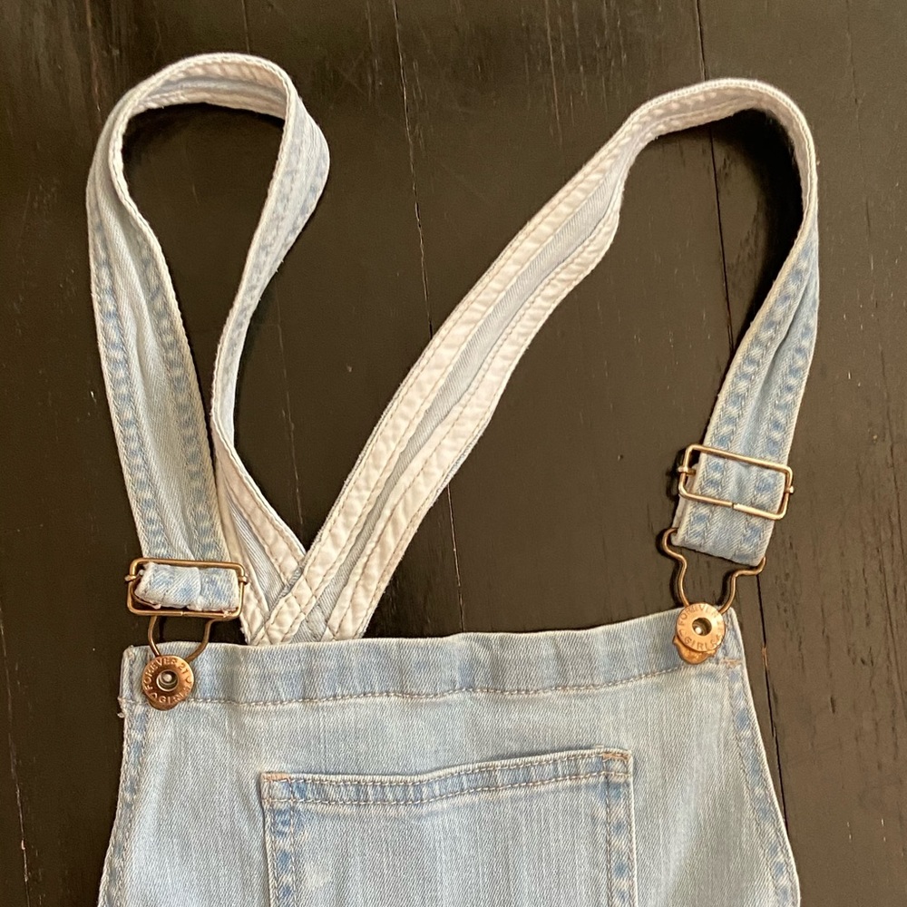 light blue denim overalls